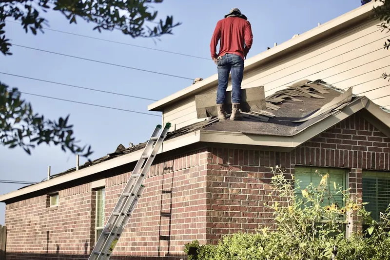 Professional roofer working on a residential roof in Harmony Park